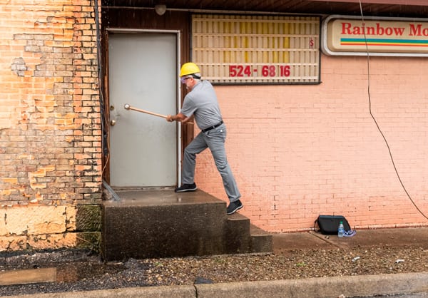 Mike Miller takes the first swing to knock the building down.